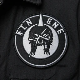 closeup photo of iron on jacket badge made of fabric, punk style