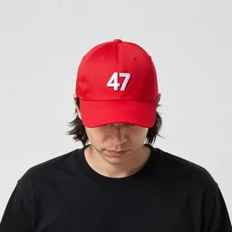 agent 4 7 wearing a red baseball cap