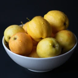 bowl of fruit, black background, depth of field