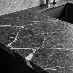 “a countertop made of black/white marble”
