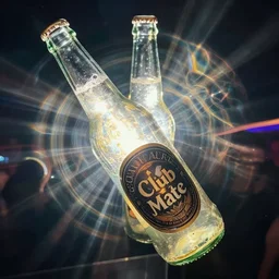 intricate, mesmerizing light refractions seen through a moving, half full Club Mate bottle, photograph, sunshine, alternativ techno club