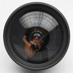 a fisheye lens angle near-under a guitarist, a slight silhouette with motion blur