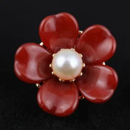 a luxury jewelry, flower forms, red glass, pearl, close up, no people blck bg