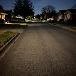 a suburban street with a carpeted floor, artificially lit