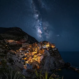 a beautiful double exposure of the astronomy picture of the day, with a rural seaside village landscape at night