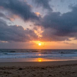 looking at the beach at sunset through dripping wet glass, rain, fog, clouds, hdr, metallic colors, photography, unreal engine, trending on artstation, photorealistic, octane, trending on deviantart