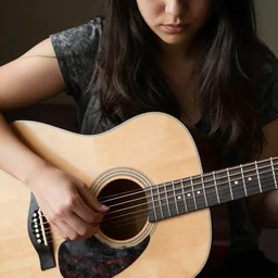 extremely acoustic woman whose veins are black nylon guitar strings