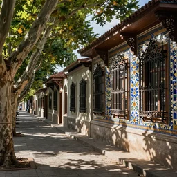 tree-lined street in a very old very beautiful city by  Nicholas Roerich and  Annie Swynnerton, ornate wrought iron, strong dramatic cinematic lighting , colorful tiled architecture, lost civilizations, smooth, sharp focus, extremely detailed