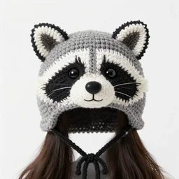 a crocheted raccoon hat, very detailed animal hat, cute details, product photo, promotional image, sharp focus, studio lighting