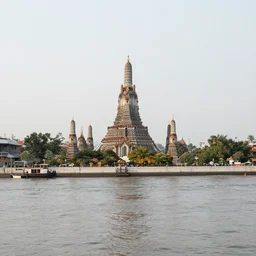 large river with a large temple floating in the middle of it