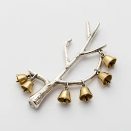 This silver implement is shaped like a tree branch and is strung with small golden bells.