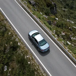 drone photography of a car on a mountain road
