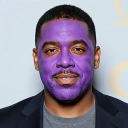 Steve harvey covered in purple face