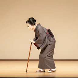 scene from a bunraku japanese puppet theater, a lone old woman walks bent over using a walking cane, side view