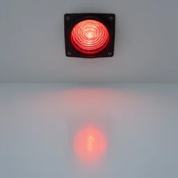 red light from above is reflected on the white floor below