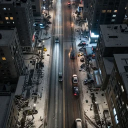 a city street at night, snowing, photograph, cyberpunk, sharp focus, intricate detail, Desolate, drone shot, high resolution, 8K