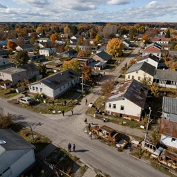 top down aerial view of dilapidated kindergarden and suburb real life, desolate with zombies, dilapidated, zombies in the streets, nightmarish, some rusted style parked vehicles, sunny weather, few clouds, volumetric lighting, photorealistic, daytime, autumn, sharp focus, ultra detailed, cgsociety