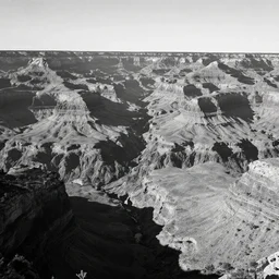 black and white landscape photo of a large canyon
