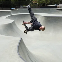 Stephen Hawking doing a flip off a ramp at a skate park