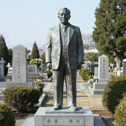 a memorial sculpture of noriaki kakyoin in a cemetery
