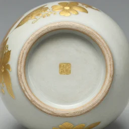 photo of an ancient japanese ceramic, micro detail, ( ( ( gold fixtures ) ) )