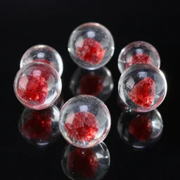 clear glass spheres with rubies inside