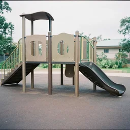 photo of a brutalist playground. soft lighting, film