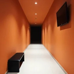 fancy corridor with orange walls and white tile floor. black bench on the left. tv hanging in the right upper corner. end of the corridor is dark and hard to see.
