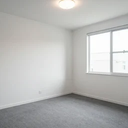 empty bedroom, grey carpet on the floor, blank white walls, soft ceiling light, single window on the right side, XF IQ4, 150MP, 50mm, F1.4, ISO 200, 1/160s, natural light