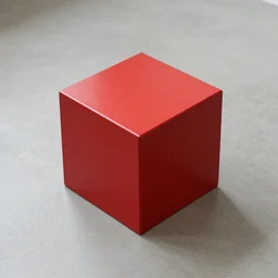 a red metallic cube on floor
