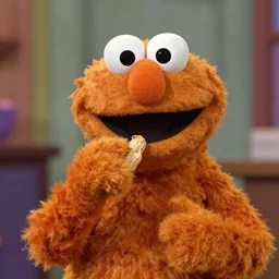 the predator as a muppet in sesame street eating peanuts