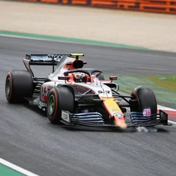 photo of formula one cars in a race