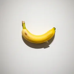 a banana taped to the wall in a gallery