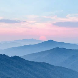 a beautiful view of blue mountains with a pink and blue rising sun cloudy sky, watercolor-wash, soft pastel colors