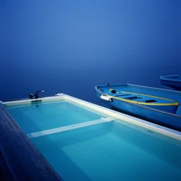 a boat, the vintage swimming pools, fog, deep blue mood, colorful, contemporary archival color photograph print from the original negative