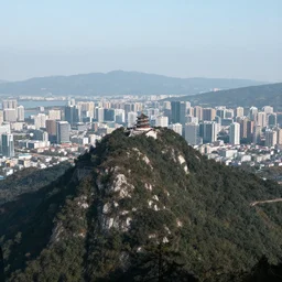 a city on top of a tall mountaintop