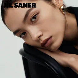 close up of face of fashion model sitting on chair, official jil sander editorial