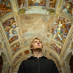 michaelangelo looking up at the unpainted ceiling of the sistine chapel
