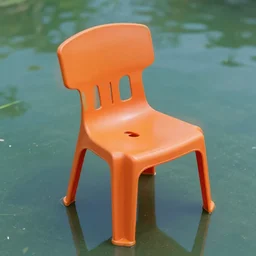 plastic orange chair in the pond