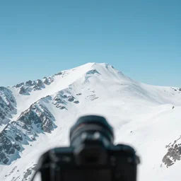 mountain shot on camera, lens focused on mountain, beautiful and clear mountain, ultra realistic, snow covered mountain, natural, 8 k render