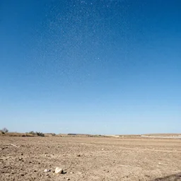 Massive drops of water in a perfect blue sky above dry land, sunny weather, saturated colors, hyper detailed photorealistic