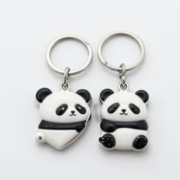 two keyring with a panda motif split heart