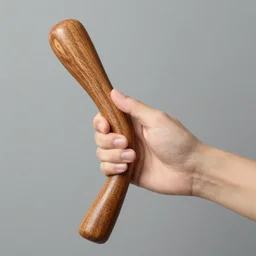 hand holding a thick wooden handle