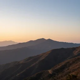a photorealistic image, mountains, sunset, panorama, professionally retouched, soft lighting, hyper realistic, wide angle, sharp focus, 8 k high definition, 6 4 megapixels, insanely detailed, stunningly beautiful