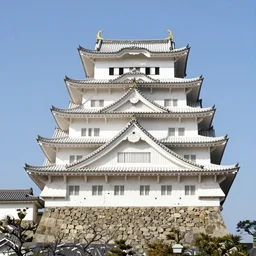 himeji castle, japanese white castle on a bright day by bardley noah