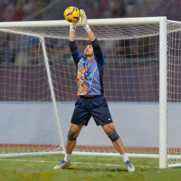 a realistic hyperdetailed multi - colored digital oil full body portrait painting of a goal keeper saving a goal in the style of guy denning, ruan jia, and craig mullins. trending on artstation and deviantart. cgsociety digital art