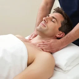 steve carell having relaxed neck massage to relax his neck and he is listening a belly