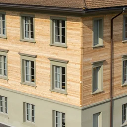 aerial view of palazzo federale in bern completely covered with wooden planks nailed to the walls