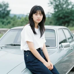 A young japanese woman sitting on a car, 1972