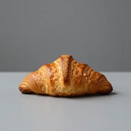 professional studio photography of a croissant on a table, grey background, balanced lighting, xf iq 4, f / 1. 4, iso 2 0 0, 1 / 1 6 0 s, 8 k, raw, unedited, symmetrical balance, in - frame